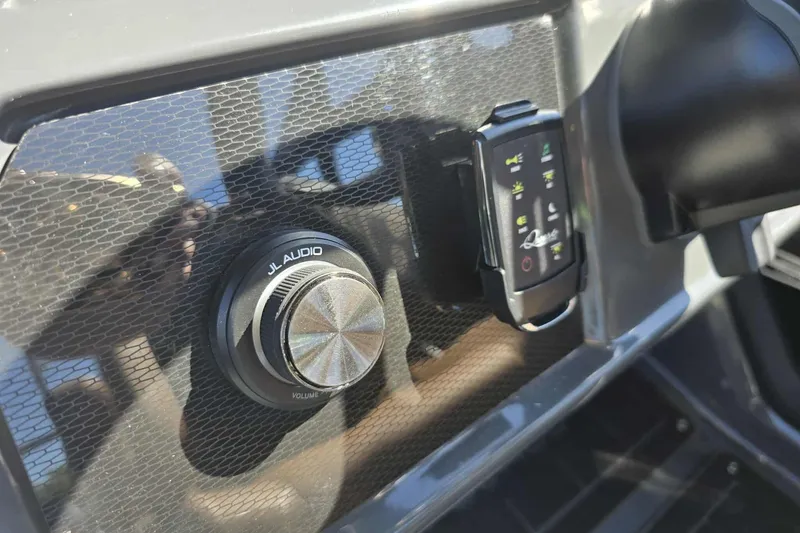 Slide: The Image of Control panel of 2026 Qwest 22RLS with JL Audio volume knob and digital display. - 11