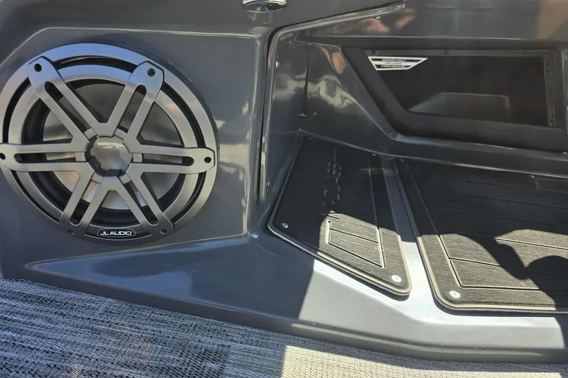 Slide: The Image of 2026 Qwest 22RLS boat interior with JL Audio speaker and sleek design. - 14