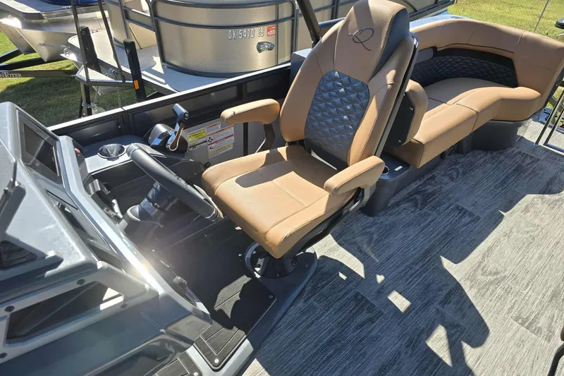 Slide: The Image of Interior of 2026 Qwest 22RLS boat with modern helm and comfortable seating. - 6