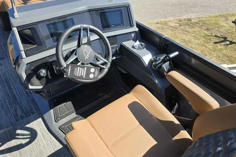 Slide: The Image of 2026 Qwest 22RLS boat interior with modern steering wheel and control panel. - 8