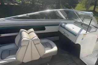 Slide: The Image of 1993 Four Winns 190 Horizon boat interior with seating and dashboard. - 10