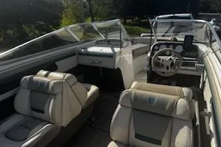 Slide: The Image of 1993 Four Winns 190 Horizon boat interior with seating and steering wheel. - 11
