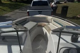 Slide: The Image of 1993 Four Winns 190 Horizon boat interior with seating, parked on a trailer. - 4