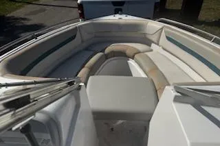 Slide: The Image of 1993 Four Winns 190 Horizon boat interior with cushioned seating. - 5