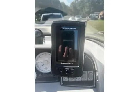 Slide: The Image of Fishfinder on 1993 Four Winns 190 Horizon dashboard, sunny day, road in background. - 7