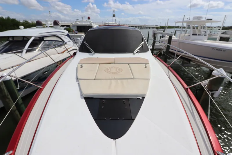 Slide: The Image of Azimut Nexus X47 2020 yacht docked, featuring sleek design and sunbathing area. - 10