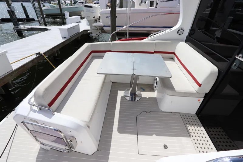 Slide: The Image of Azimut Nexus X47 2020 yacht with sleek seating and table on deck. - 13