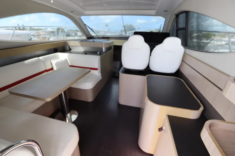 Slide: The Image of Interior of 2020 Azimut Nexus X47 yacht with modern seating and dining area. - 15