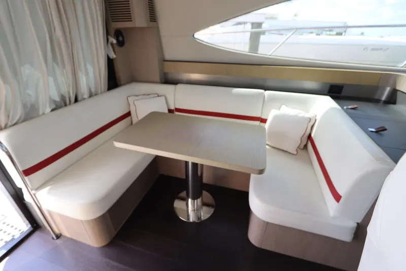 Slide: The Image of Luxurious interior of 2020 Azimut Nexus X47 yacht with elegant seating and table. - 16
