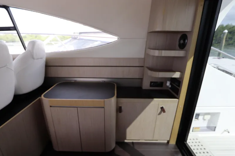 Slide: The Image of Interior of 2020 Azimut Nexus X47 yacht with modern wood cabinetry and seating. - 17