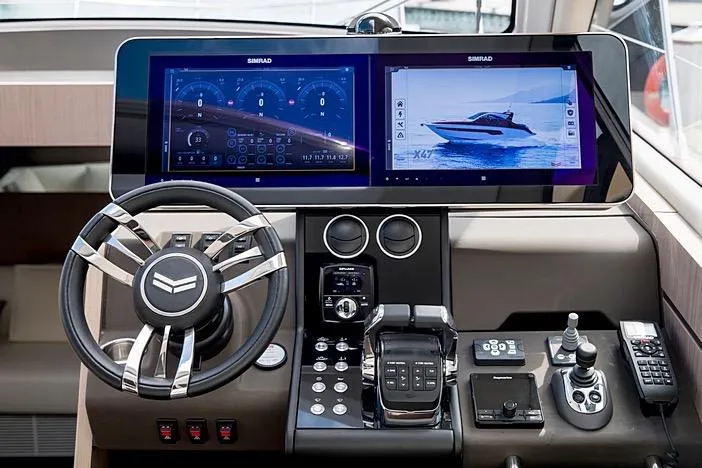 Slide: The Image of Cockpit of 2020 Azimut Nexus X47 yacht with advanced navigation displays and controls. - 20