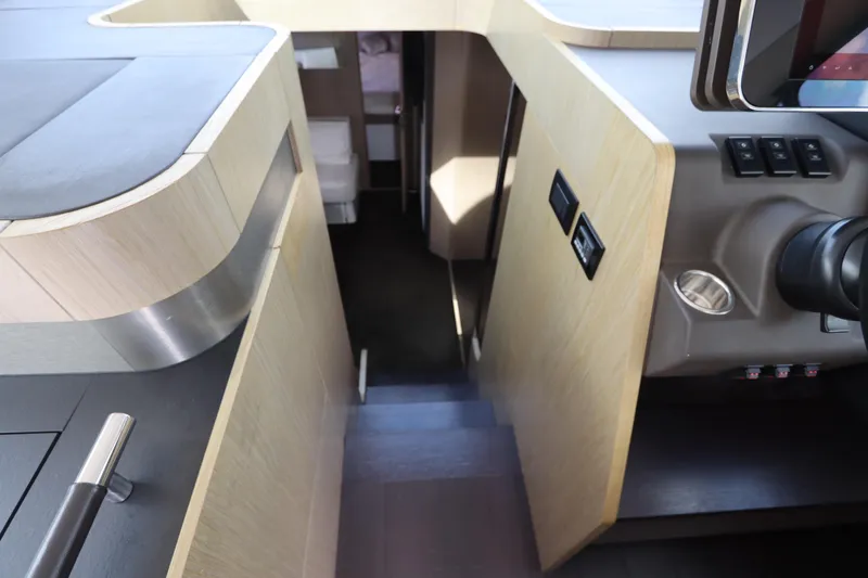 Slide: The Image of Interior view of 2020 Azimut Nexus X47 yacht, featuring modern design and sleek wood finishes. - 24