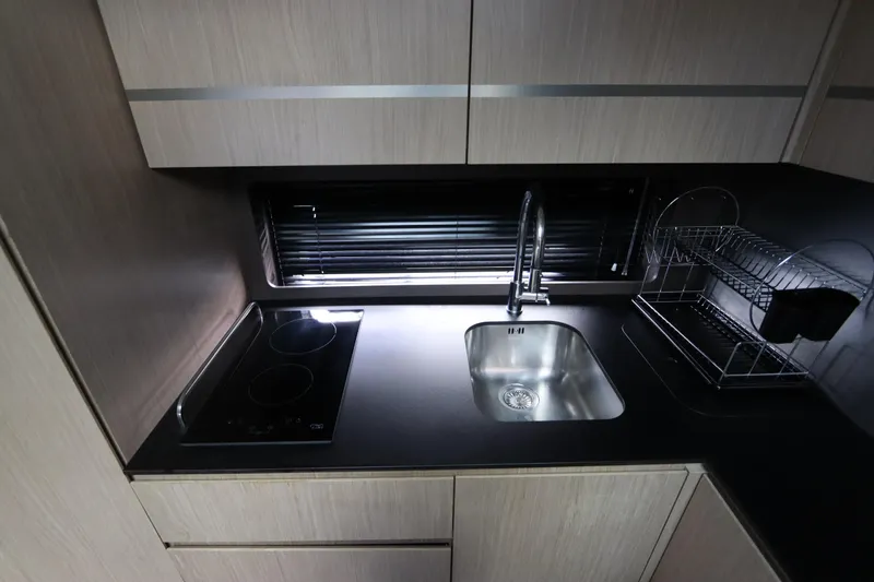 Slide: The Image of Modern kitchen in 2020 Azimut Nexus X47 yacht with sleek sink and stovetop. - 28