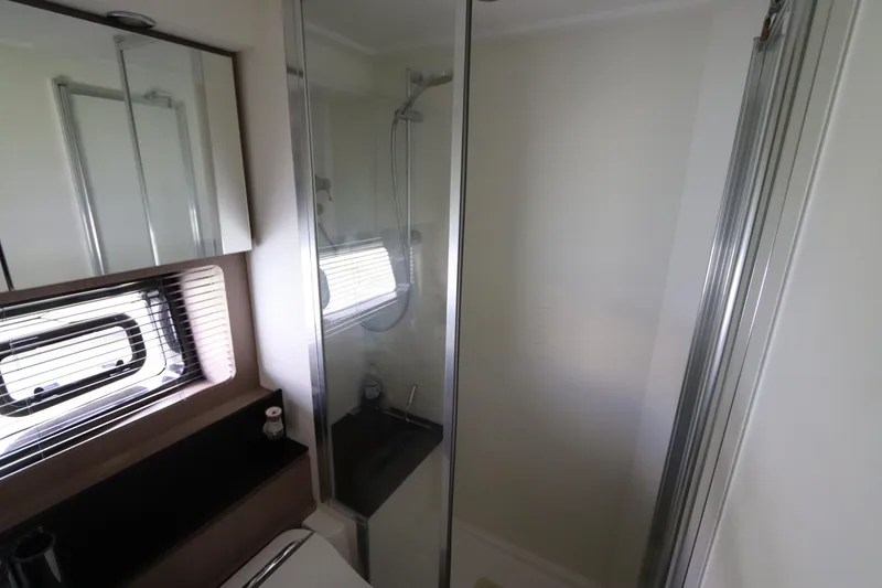 Slide: The Image of Modern bathroom interior on 2020 Azimut Nexus X47 yacht, featuring shower and window. - 33