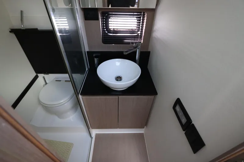 Slide: The Image of Modern bathroom in 2020 Azimut Nexus X47 yacht with sleek sink and toilet. - 35