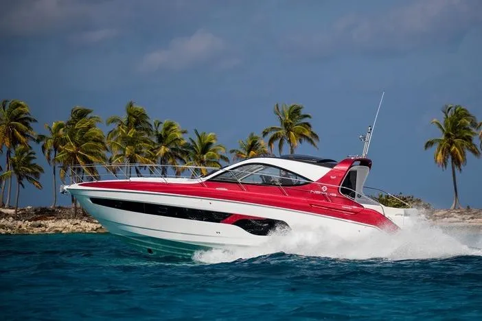Slide: The Image of Azimut Nexus X47 yacht cruising near tropical island, 2020 model, vibrant red and white design. - 45