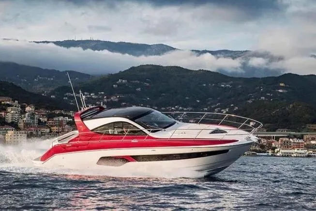 Slide: The Image of 2020 Azimut Nexus X47 yacht cruising on scenic coastal waters. - 47