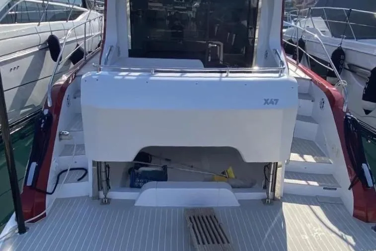 Slide: The Image of Azimut Nexus X47 2020 yacht rear view, docked with open deck and modern design. - 5