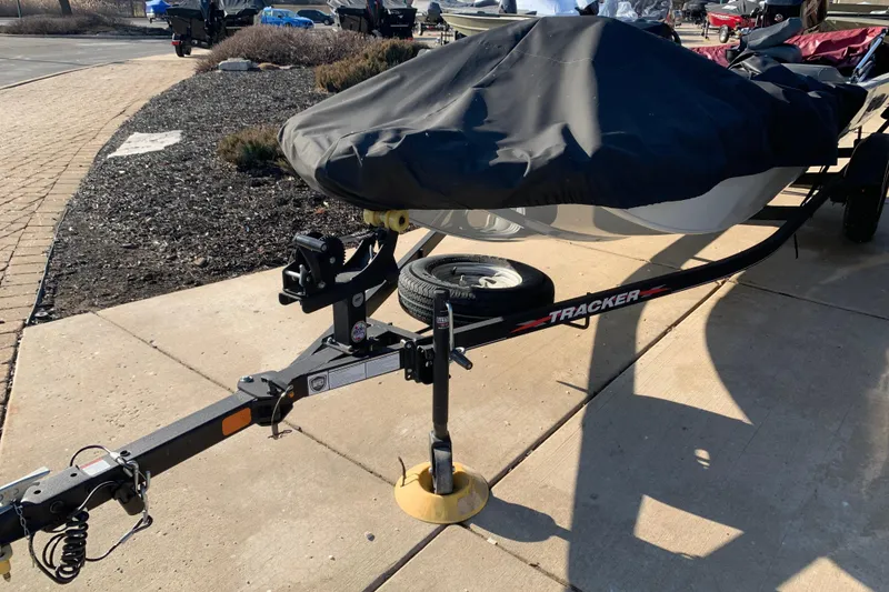 Slide: The Image of 2023 Tracker Pro 170 boat on trailer with cover, parked on concrete. - 10