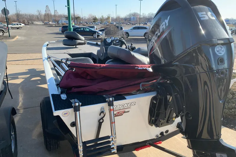 Slide: The Image of 2023 Tracker Pro 170 boat with Mercury engine in parking lot. - 11