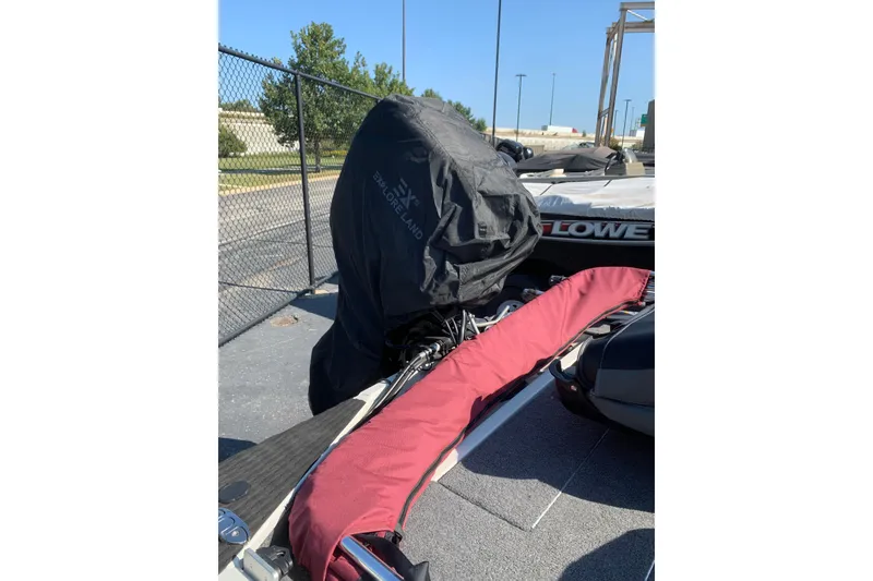 Slide: The Image of 2023 Tracker Pro 170 boat with covered motor and red protective cover. - 12