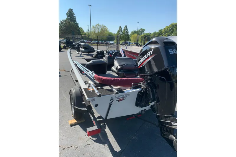 Slide: The Image of 2023 Tracker Pro 170 boat dashboard with steering wheel and gauges. - 3