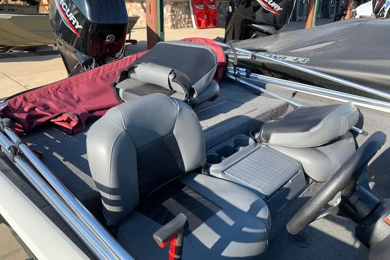 Slide: The Image of 2023 Tracker Pro 170 boat interior with gray seating and Mercury engine. - 9