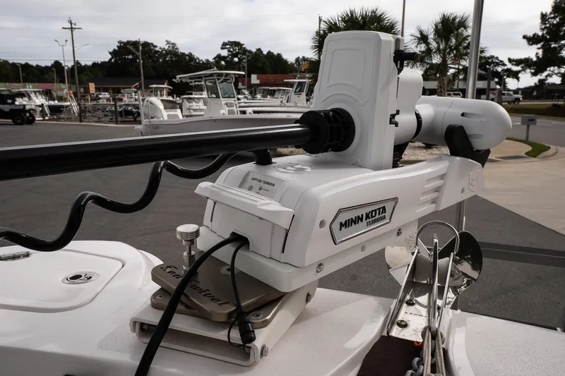 Slide: The Image of Minn Kota Terrova motor on 2025 Twin Vee 240 GFX CC boat, docked outdoors. - 21