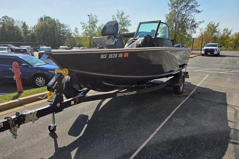 Slide: The Image of 2022 G3 Angler V1850 boat with Yamaha outboard motor on a trailer. - 2