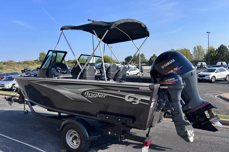 Slide: The Image of 2022 G3 boat with Yamaha outboard motors in a parking lot. - 6