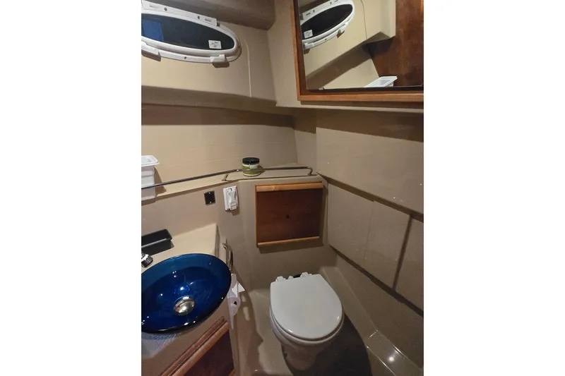 Slide: The Image of 2015 Cutwater C28 boat docked in a marina under a partly cloudy sky. - 3