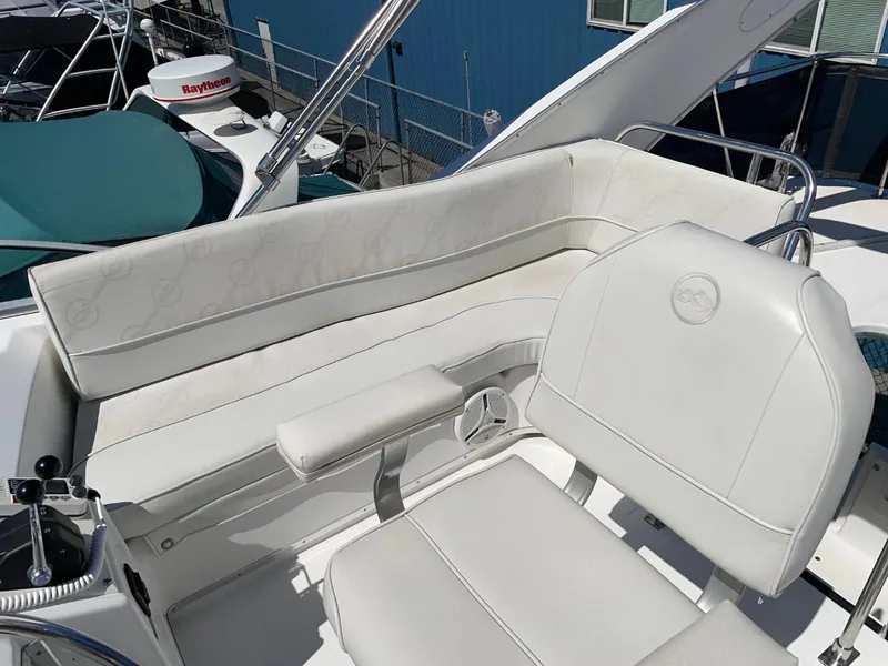 Slide: The Image of 1999 Bayliner 3388 Command Bridge Motoryacht with white seating and helm station. - 14