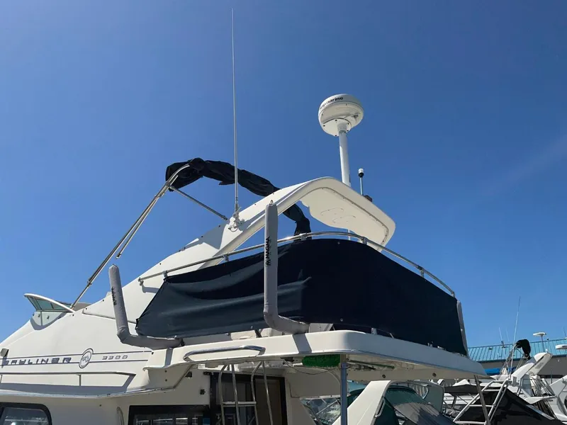 Slide: The Image of 1999 Bayliner 3388 Motoryacht under clear blue sky. - 2