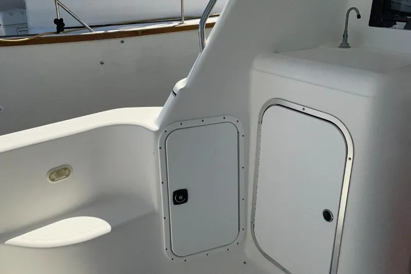 Slide: The Image of 1999 Bayliner 3388 Motoryacht interior with storage compartments and sink. - 7
