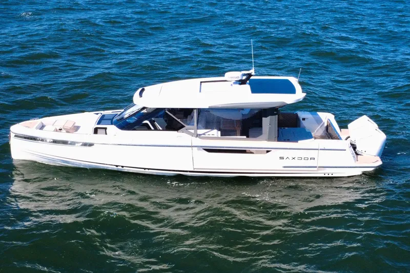 Slide: The Image of 2025 Saxdor 400 GTO luxury yacht cruising on open water. - 12