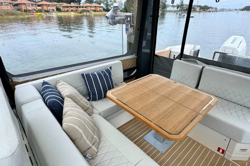 Slide: The Image of Luxurious interior of 2025 Saxdor 400 GTO yacht with elegant seating and wooden table. - 21