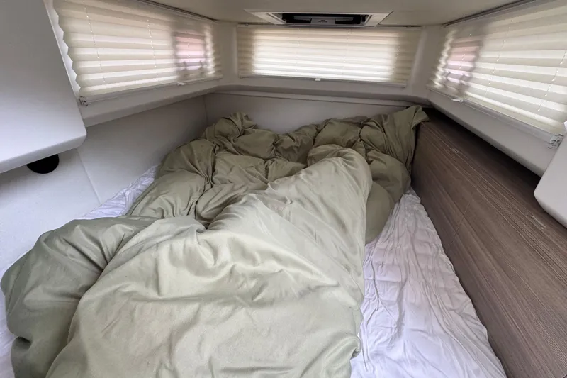 Slide: The Image of 2025 Saxdor 400 GTO cabin interior with open storage compartment and wooden flooring. - 23