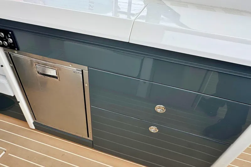 Slide: The Image of Outdoor kitchenette on 2025 Saxdor 400 GTO boat with stove and sink. - 25