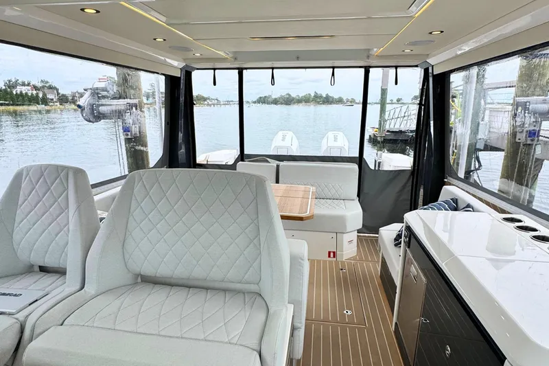 Slide: The Image of Control panel on 2025 Saxdor 400 GTO boat, featuring seat, table, and lock buttons. - 27