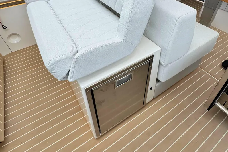 Slide: The Image of 2025 Saxdor 400 GTO interior with plush, diamond-stitched seating and elegant wooden table. - 29