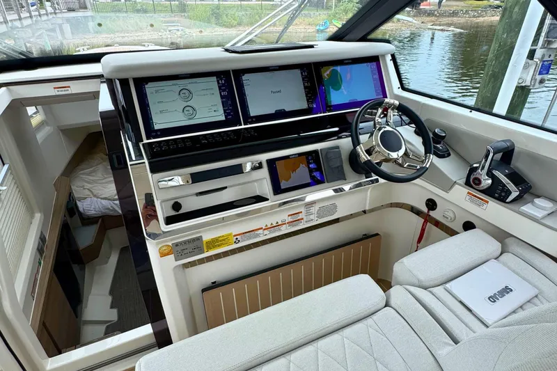 Slide: The Image of 2025 Saxdor 400 GTO interior with cushioned seating and integrated storage on a wooden deck. - 30