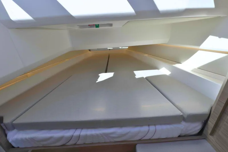 Slide: The Image of Interior cabin view of 2025 Saxdor 400 GTO boat, featuring modern design and cozy sleeping area. - 40