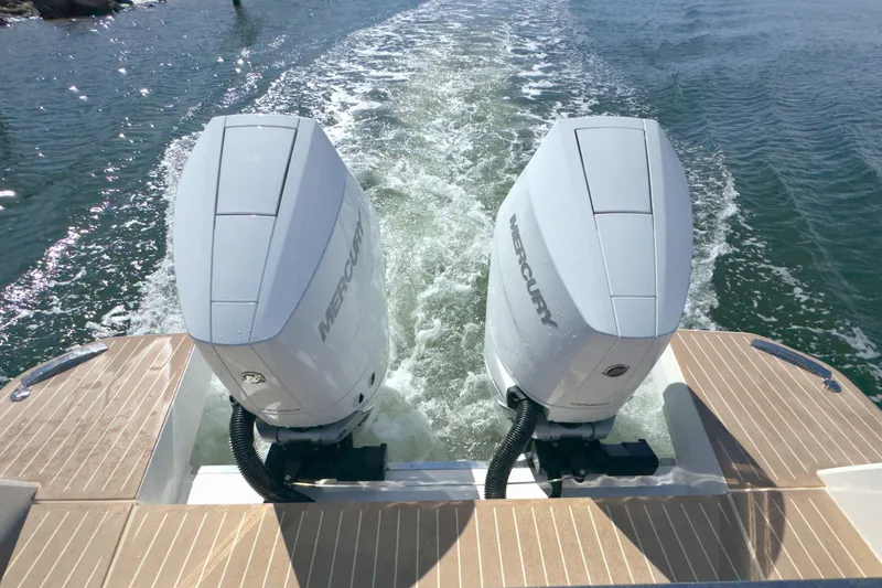 Slide: The Image of Twin Mercury outboard engines on 2025 Saxdor 400 GTO, cruising on open water. - 61