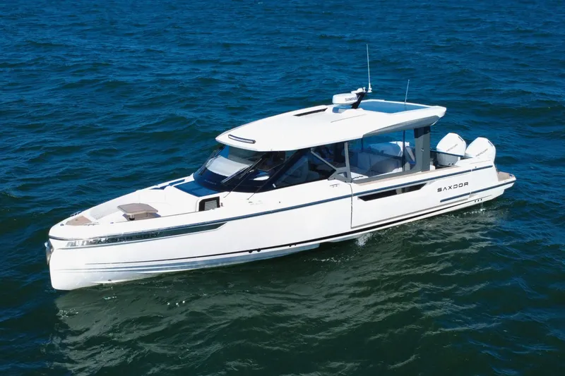 Slide: The Image of 2025 Saxdor 400 GTO boat cruising on open water, showcasing sleek design and modern features. - 8