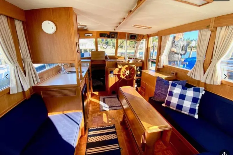 Slide: The Image of Interior of 1984 Grand Banks 36 Classic yacht with wooden furnishings and nautical decor. - 15