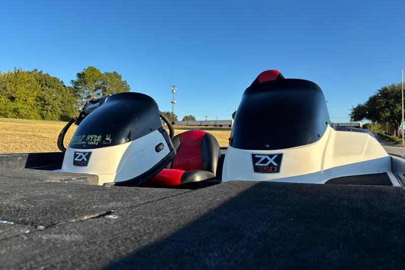 Slide: The Image of Lowrance Elite fish finder on 2011 Skeeter ZX250 boat, sunny outdoor setting. - 13