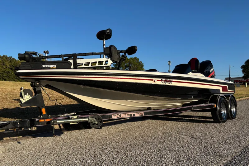 Slide: The Image of 2011 Skeeter ZX250 boat with logo, featuring sleek design and comfortable seating. - 23