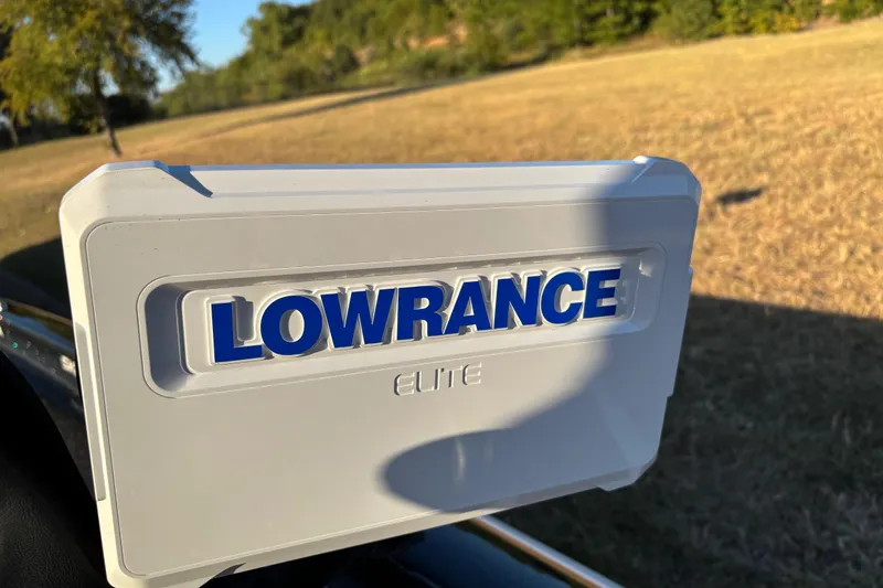 Slide: The Image of Dashboard of a 2011 Skeeter ZX250 boat with fuel, volt, and RPM gauges. - 34