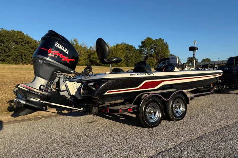 Slide: The Image of 2011 Skeeter ZX250 boat with Yamaha VMAX engine on a sunny day. - 4