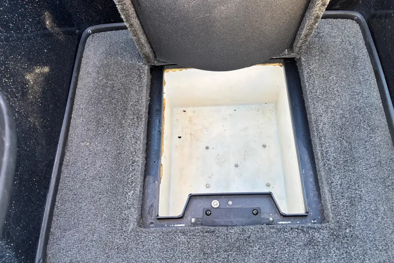 Slide: The Image of 2011 Skeeter ZX250 boat interior with red and black seats, steering wheel, and Lowrance device. - 41